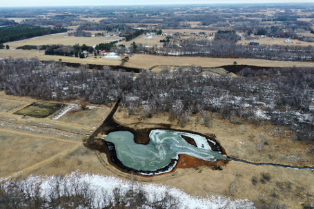 Photo: A drone photo of the Ditch 20 wetland restoration project. 
The ditch now flows through a 1.66-acre wetland restoration area to remove nutrients and sediment before it reaches Typo and Martin Lakes.