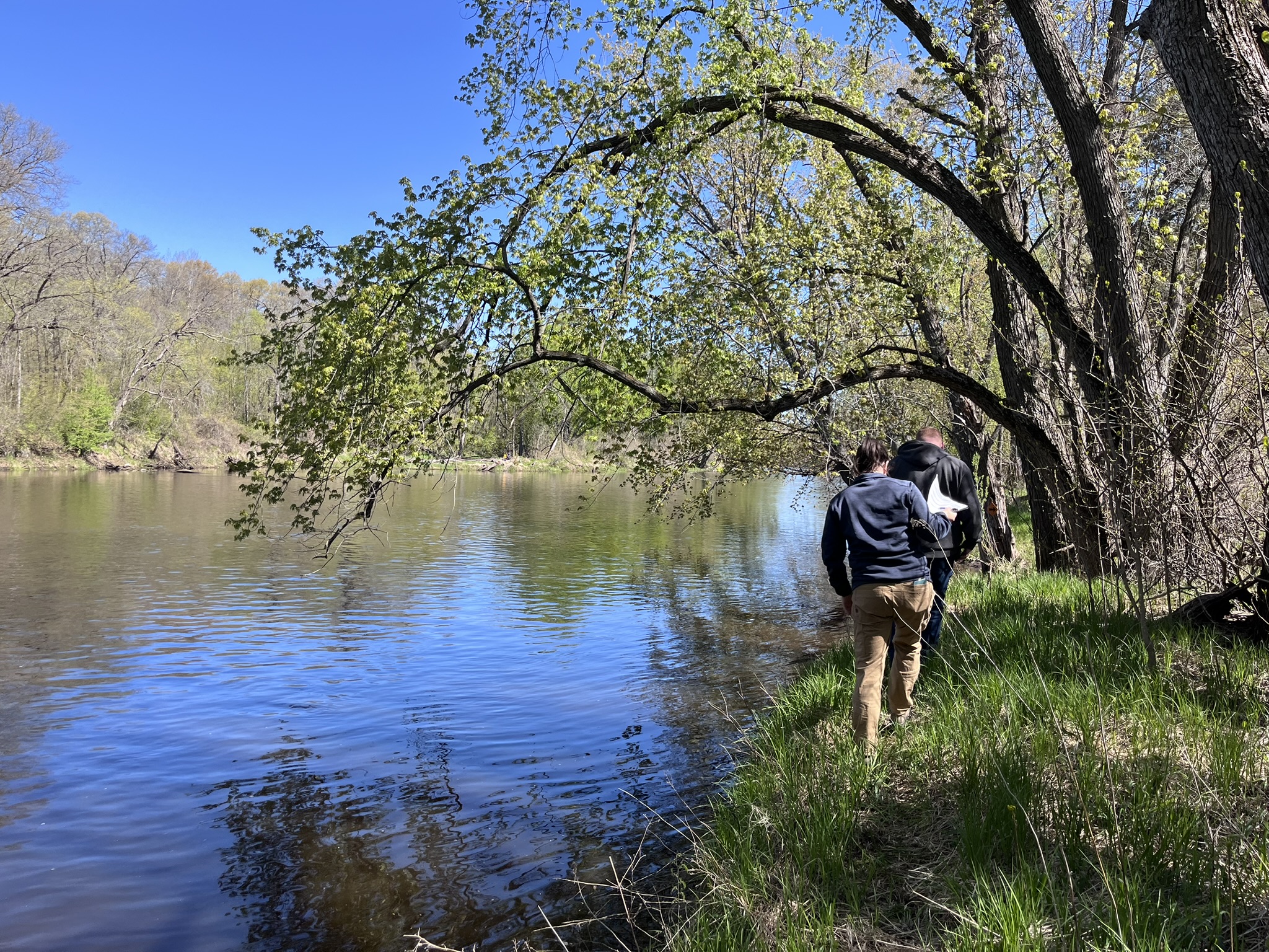 Photo: Anoka County Parks Manager, Quinn Palar, and CPL Program Administrator, Amy Yoelin, walking on top of a Rum Riverbank in Anoka County.